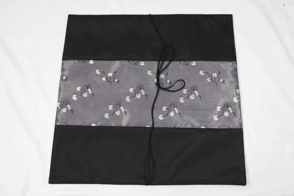 Thai cushion cover in black color with floral pattern