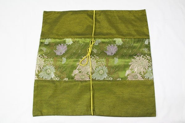 Thai cushion cover in green golden color with floral pattern