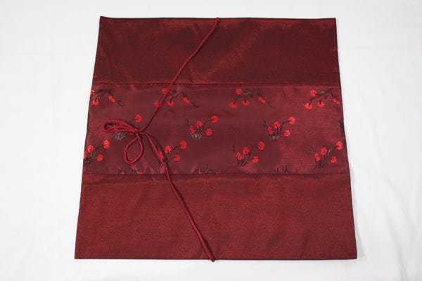Thai cushion cover in maroon color with flower pattern
