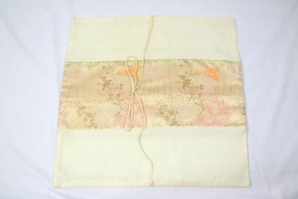 Thai cushion cover in champagne color with floral design